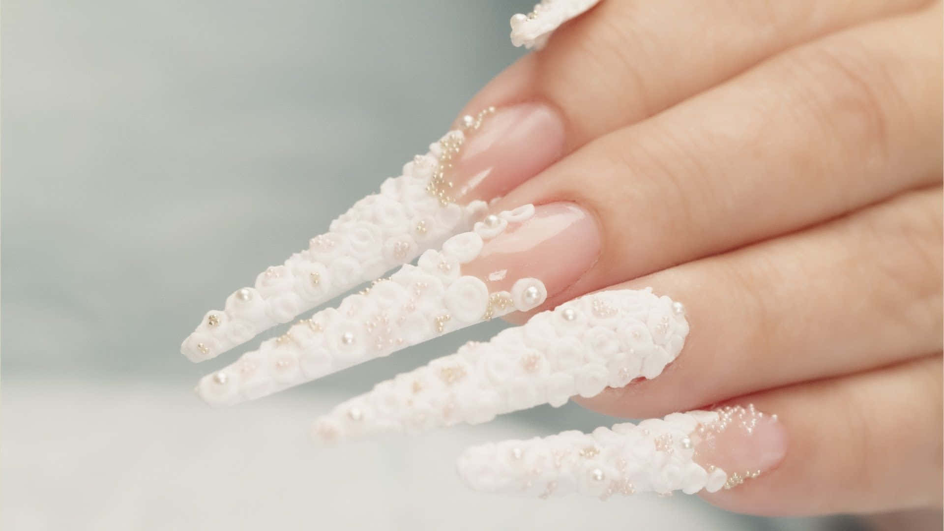 A Woman's Nails With White Pearls And Crystals Wallpaper