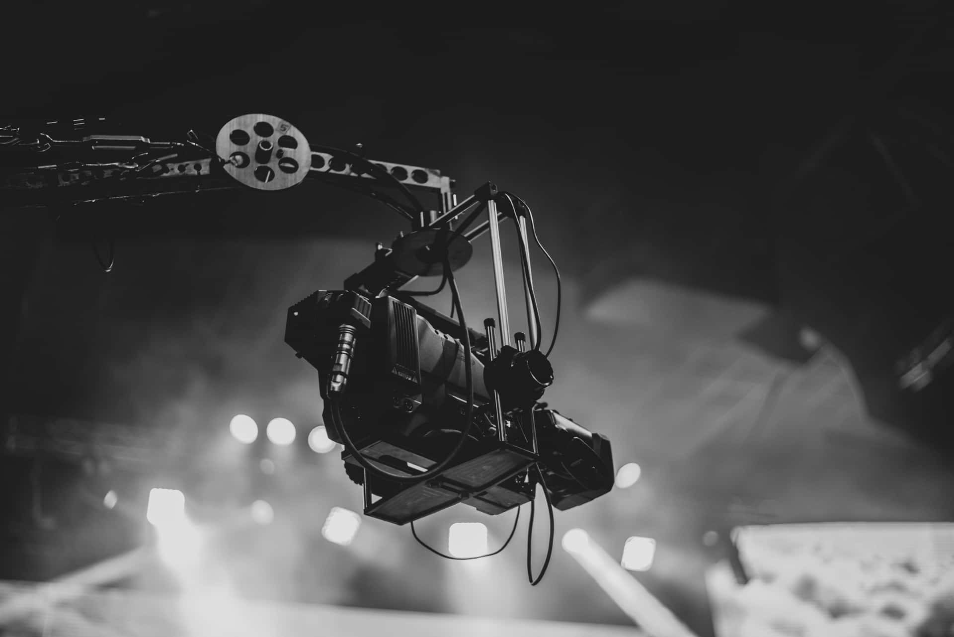 A Black And White Image Of A Camera On A Stage Wallpaper