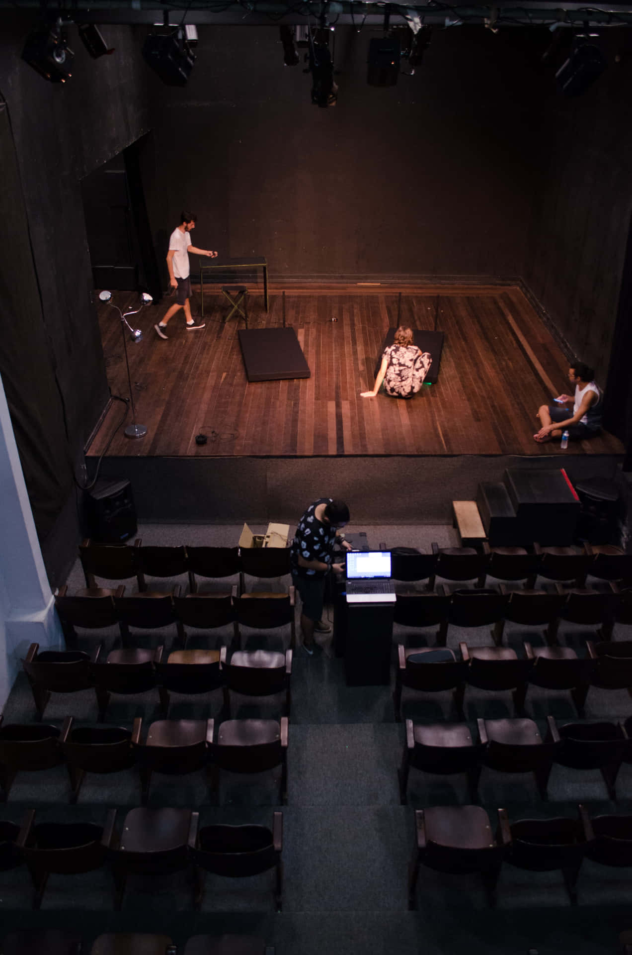A Stage With Chairs And A Laptop Wallpaper