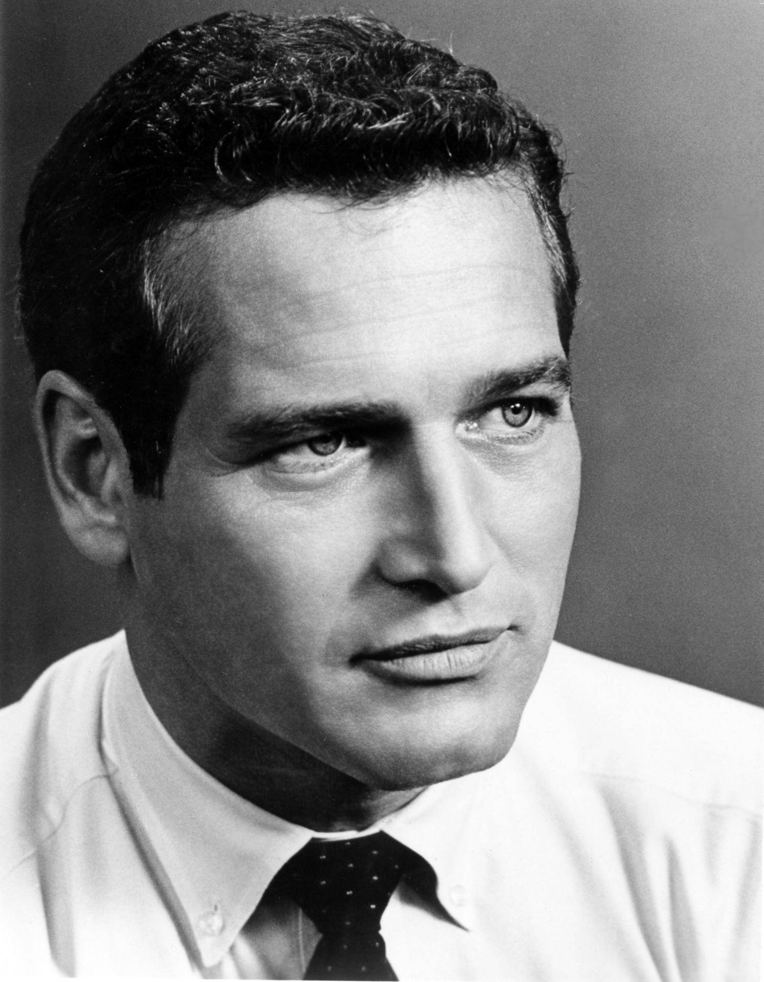 Legenden Paul Newmans ansigt smiler til dig fra denne farverige tapet. Wallpaper