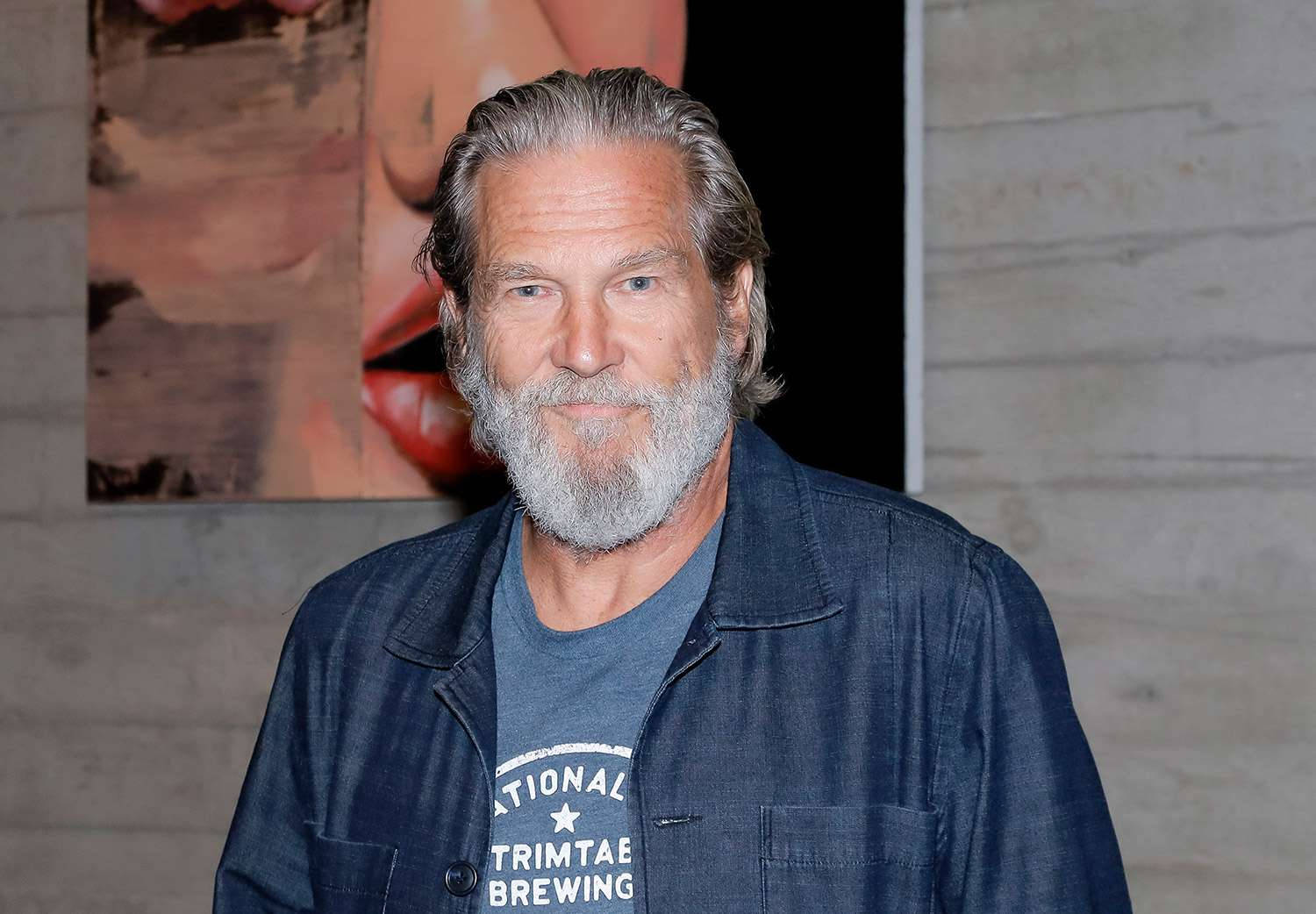 Renowned Actor Jeff Bridges elegantly dressed in a blue shirt Wallpaper