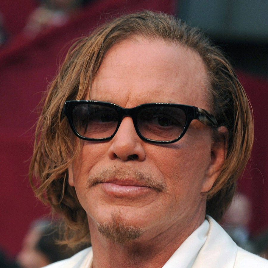Actor Mickey Rourke In White Tuxedo At Oscars Wallpaper