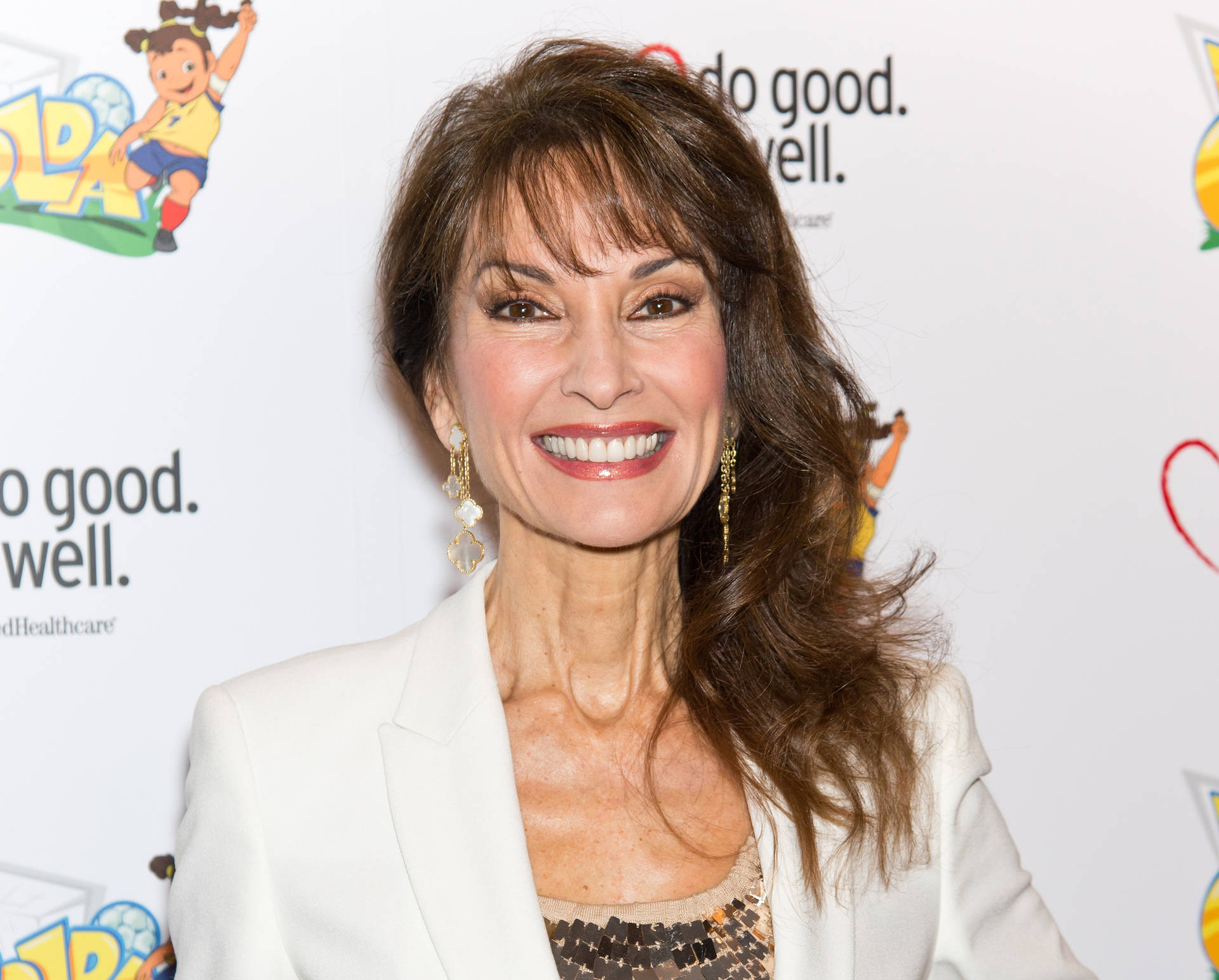 Actress Susan Lucci In White Dress Background