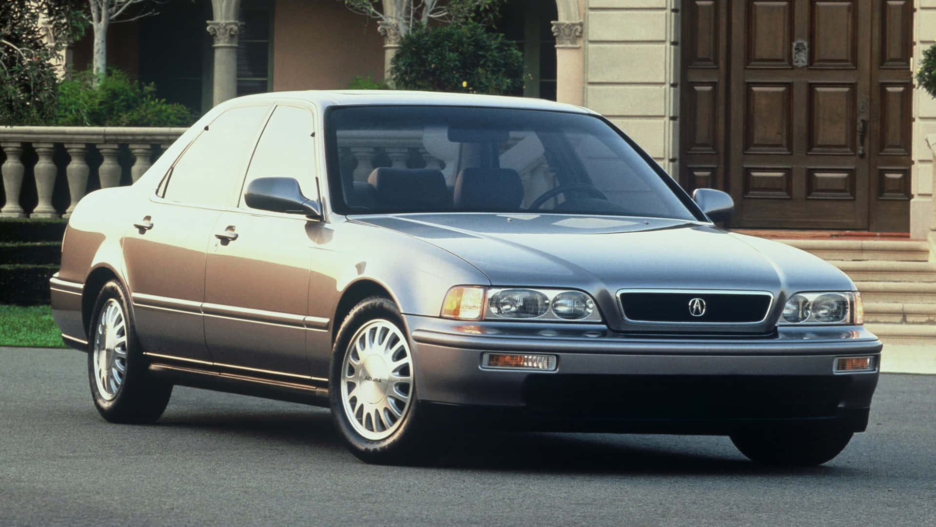 A Silhouette of the Acura Legend in Red Hues Wallpaper