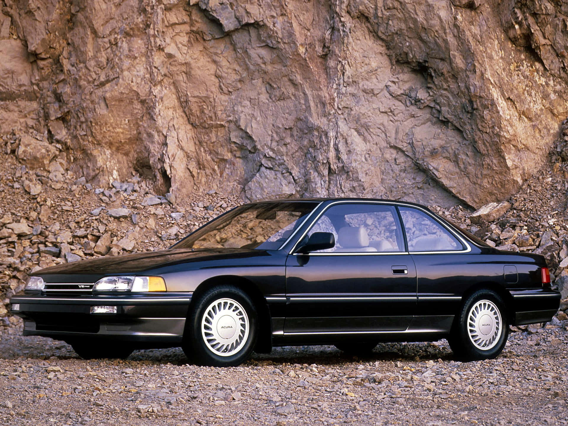 Caption: Sleek and Stylish Acura Legend on Display Wallpaper