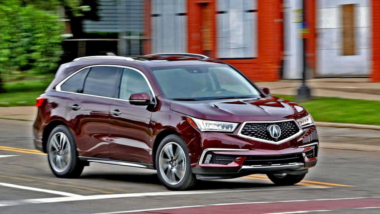 Acura MDX Luxury SUV Cruising on a Picturesque Landscape Wallpaper