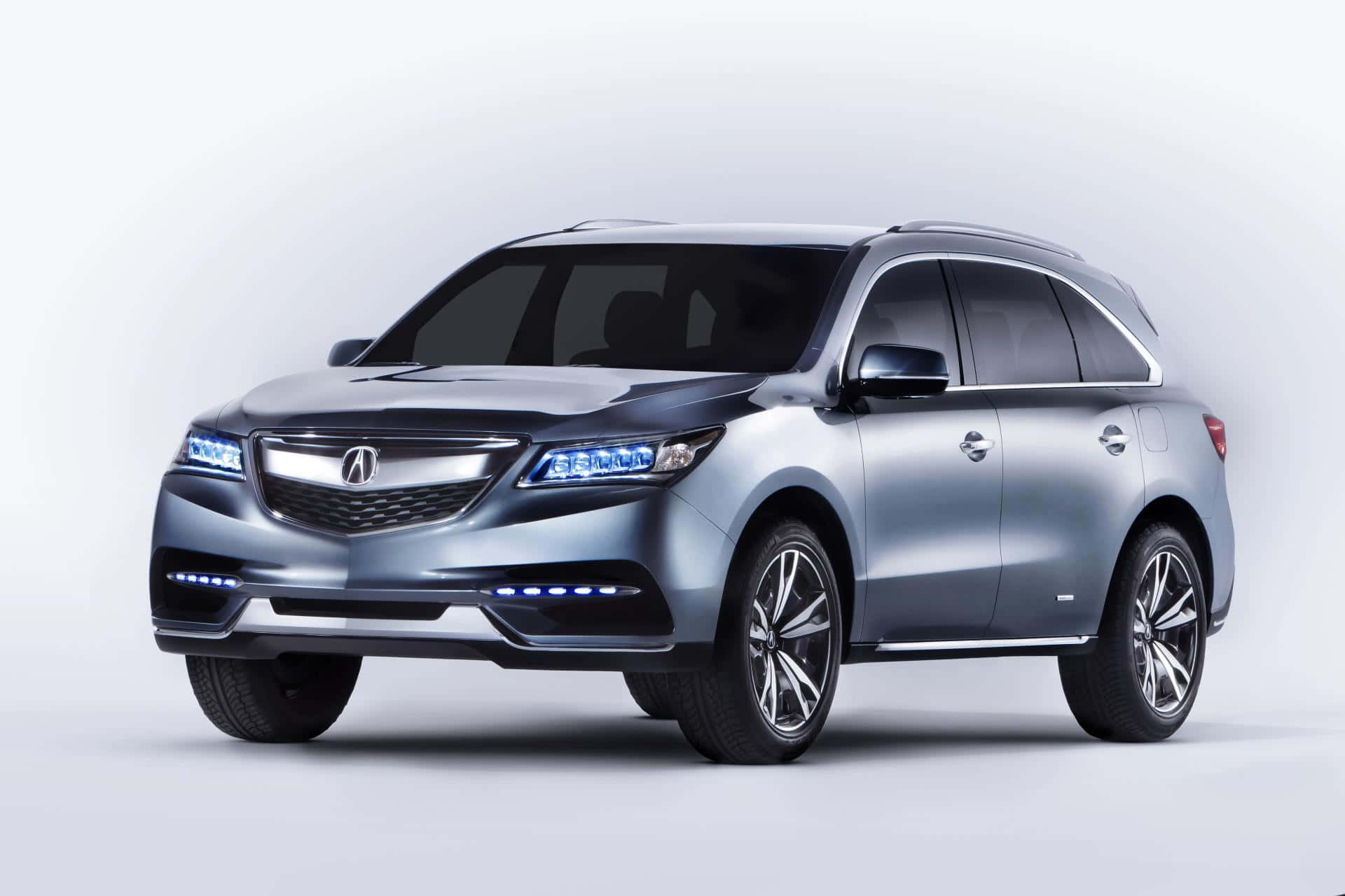 A sleek Acura MDX in a vibrant city setting Wallpaper