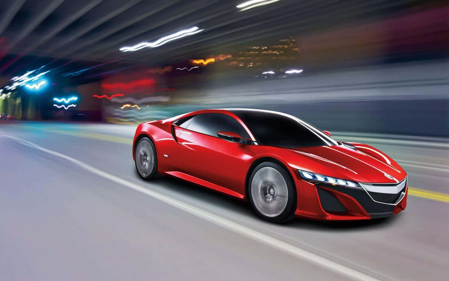 A stunning red Acura NSX showcased on an open road Wallpaper