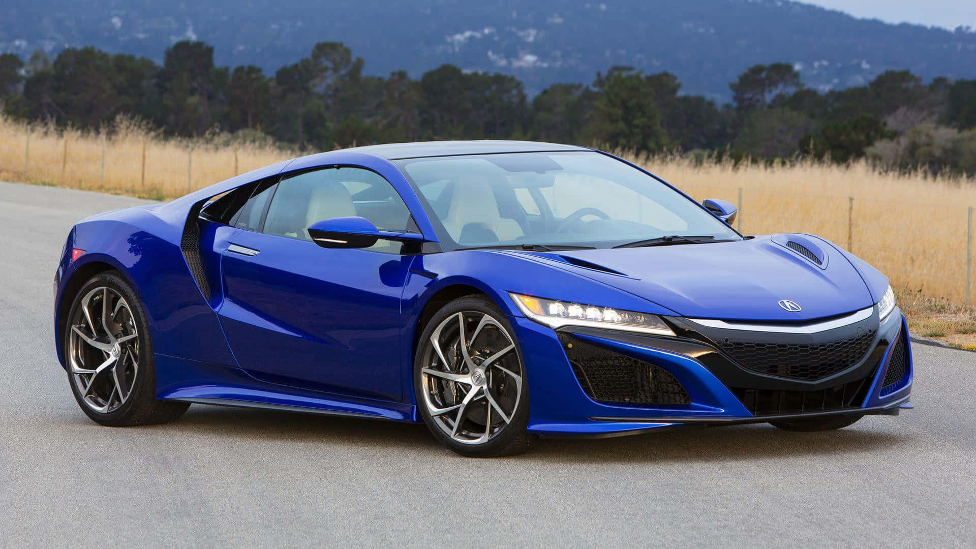 A striking Acura NSX on the road Wallpaper