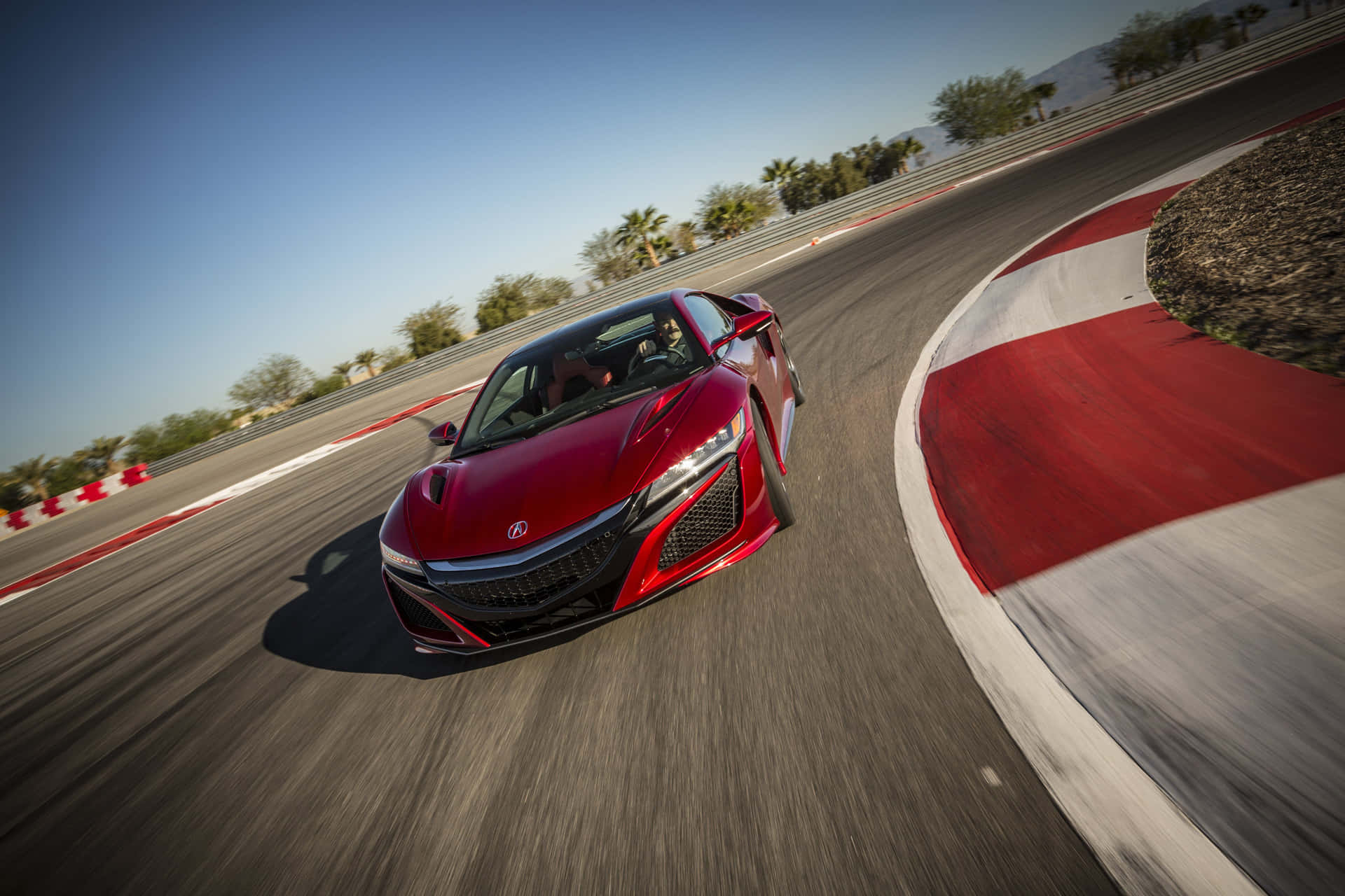 The Red Honda Nsx Is Driving On A Race Track