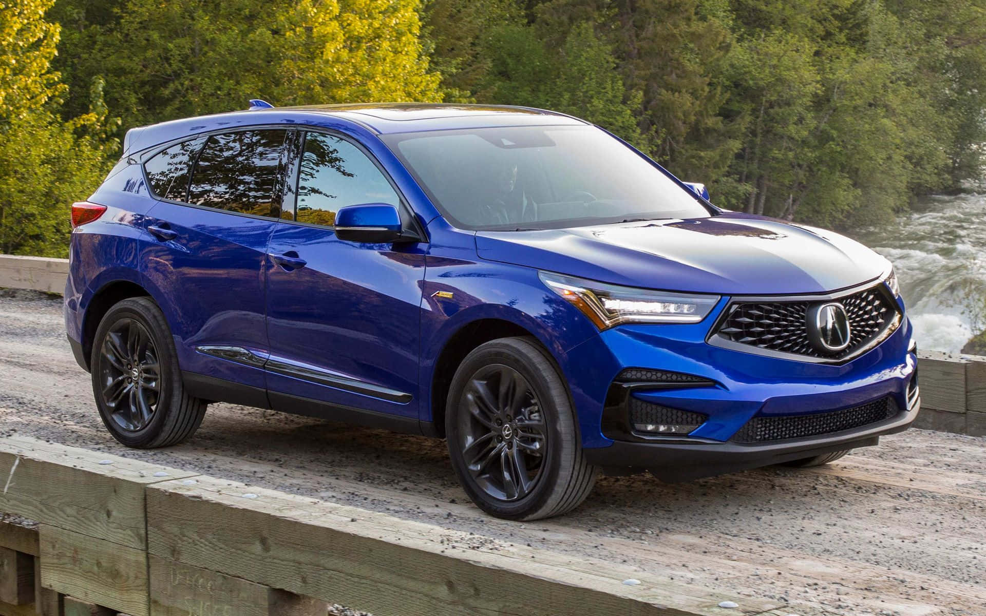 A Stunning Acura RDX in a Scenic Outdoor Setting Wallpaper