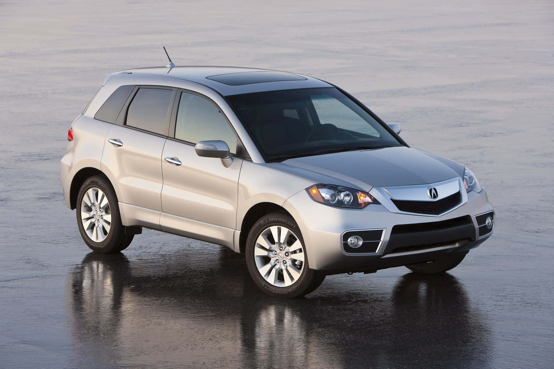 Acura RDX driving on a scenic highway Wallpaper