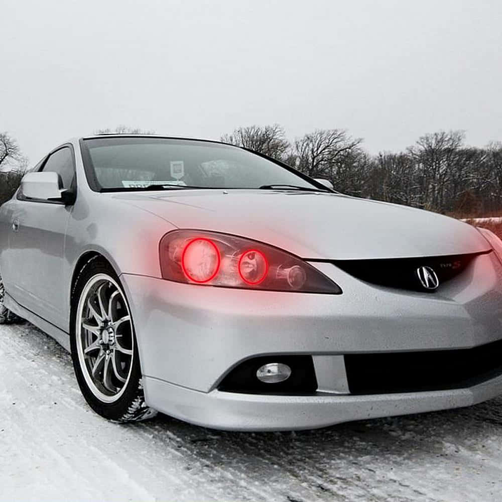 Acura RSX Sports Coupe Against a Cityscape Wallpaper