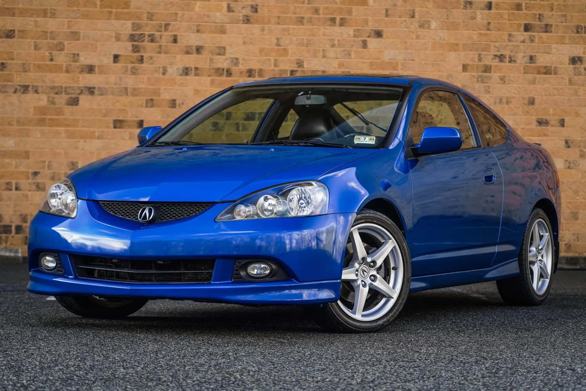 Sleek and Stylish Acura RSX on the Road Wallpaper