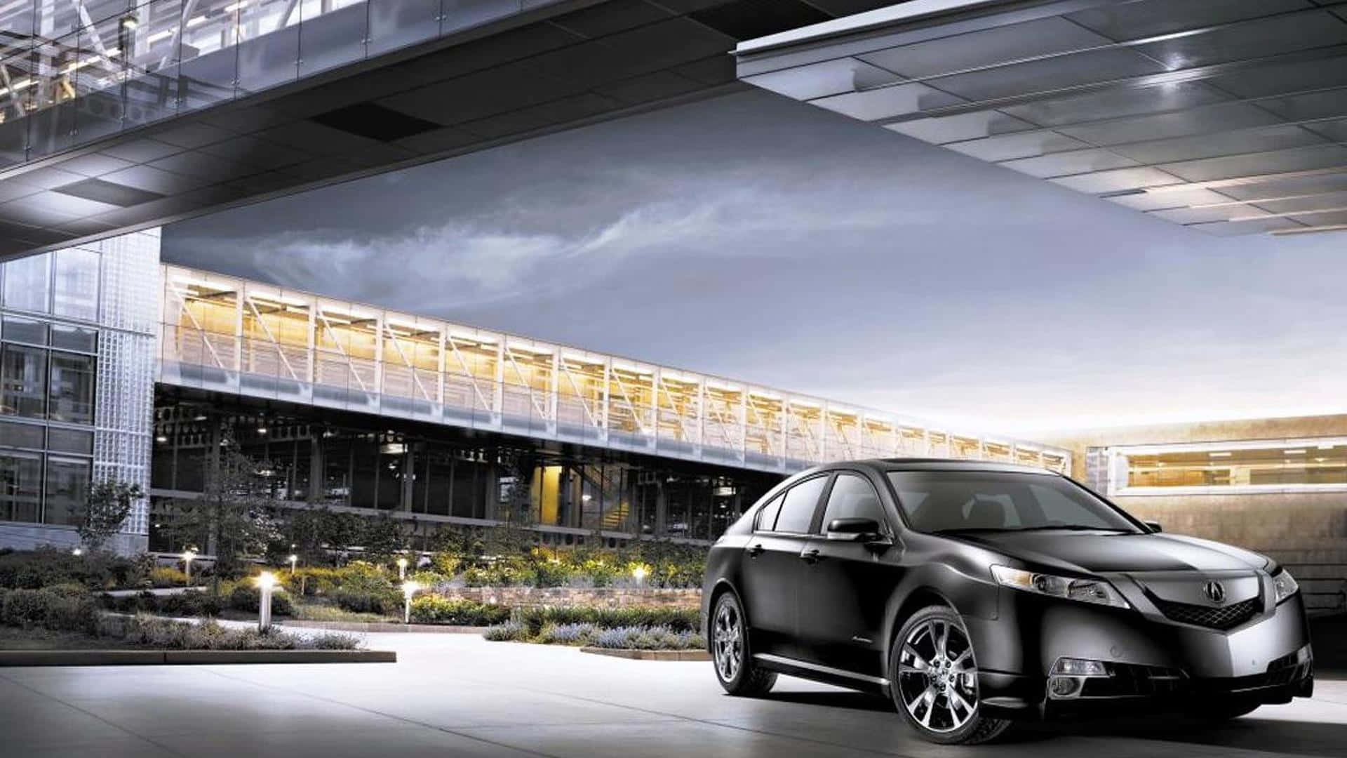 Sleek Acura TL in a stunning urban landscape Wallpaper