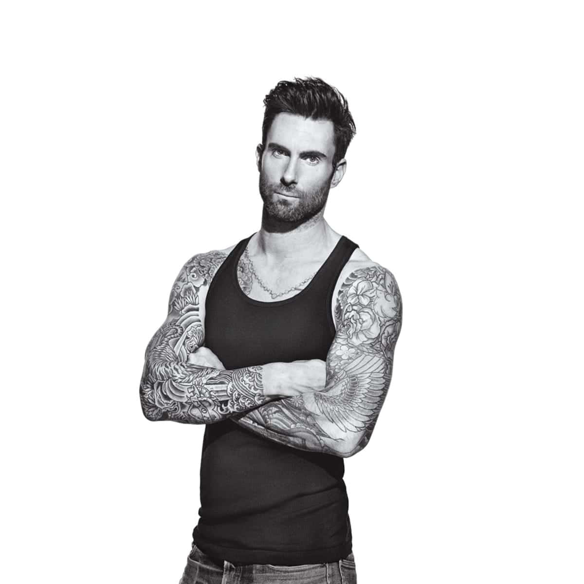 A Man With Tattoos And A Tank Top