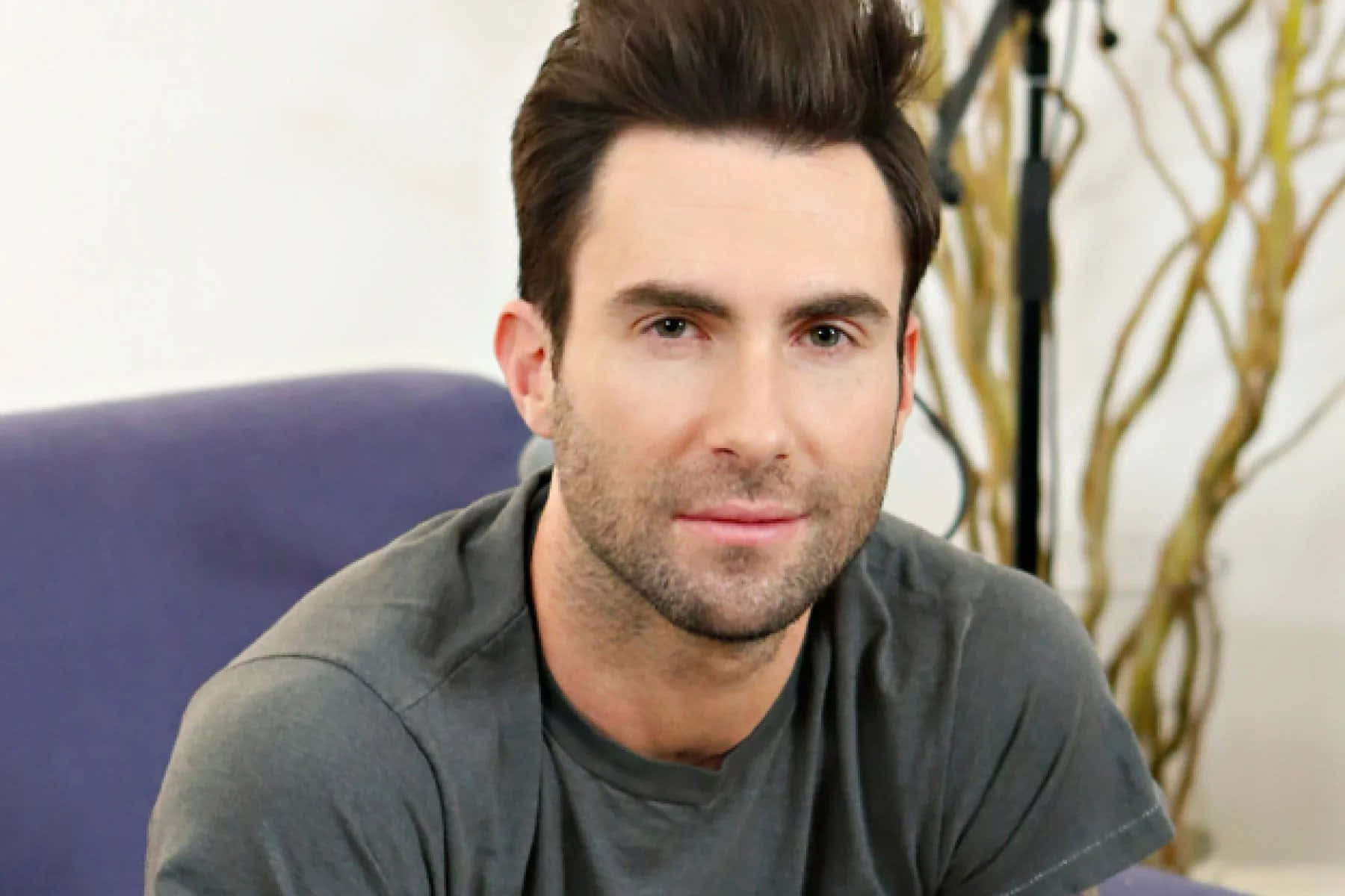 A stylish Adam Levine rocks his signature look