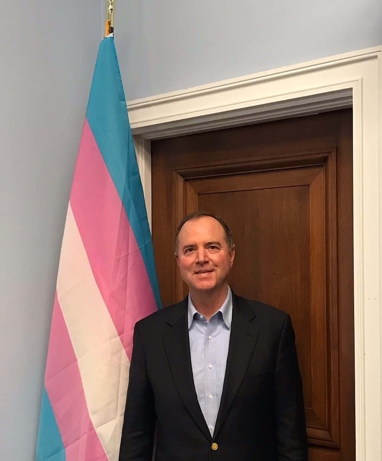 Adam Schiff Beside A Transgender Flag Wallpaper