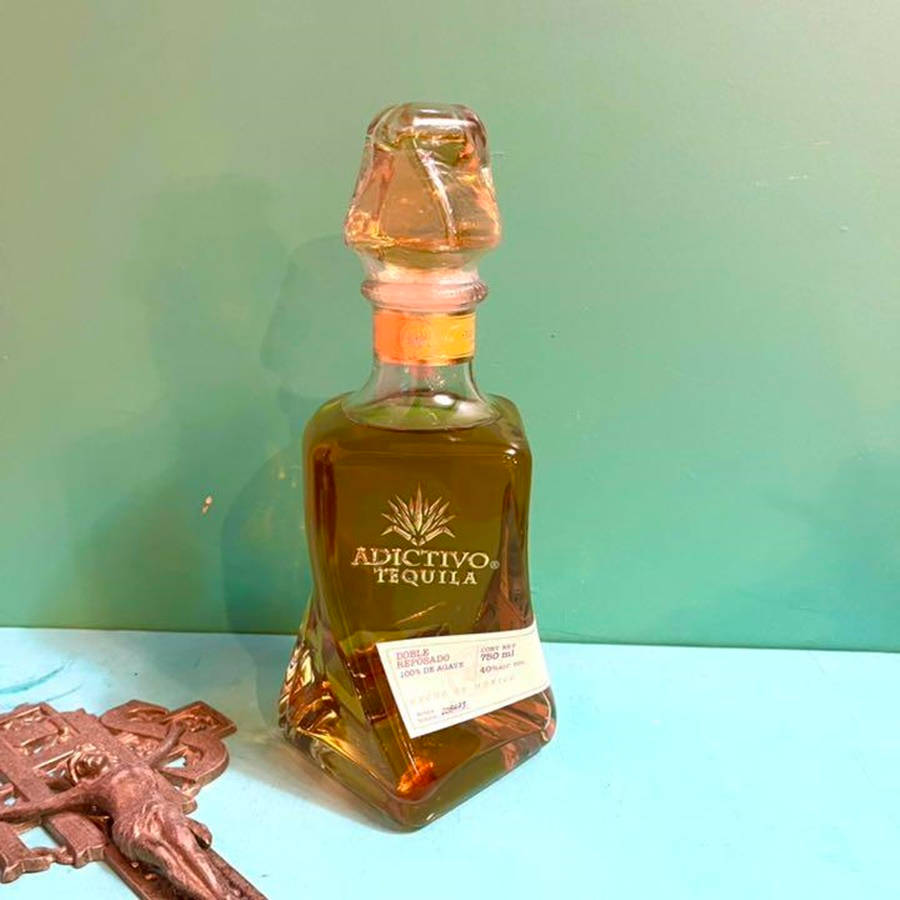 Caption: Luxurious Adictivo Extra Anejo Tequila Bottle Wallpaper