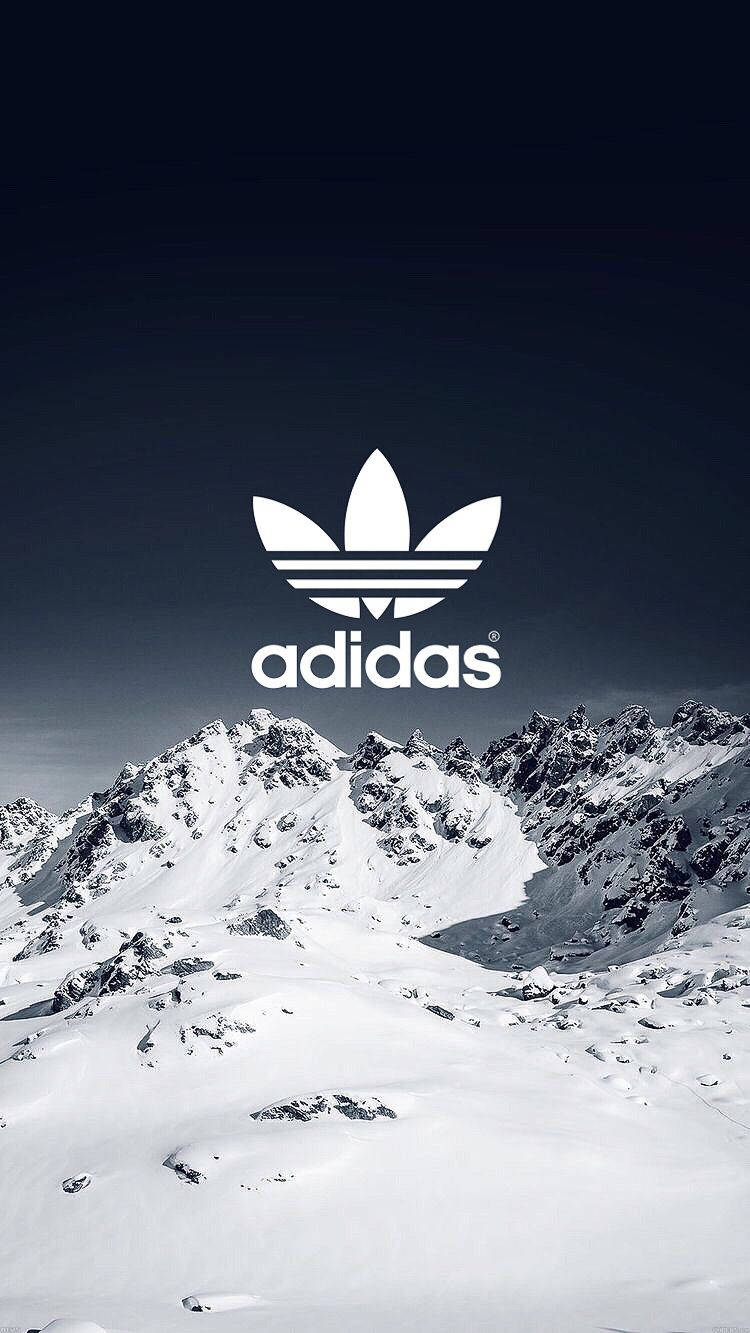 Adidas Brand On Snow Mountains Wallpaper