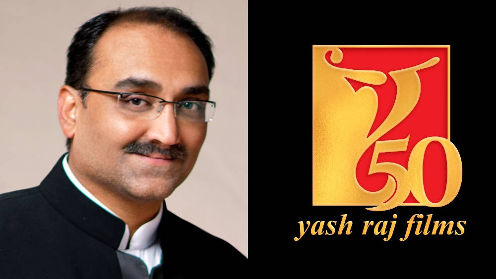 Aditya Chopra poses with the YRF logo Wallpaper
