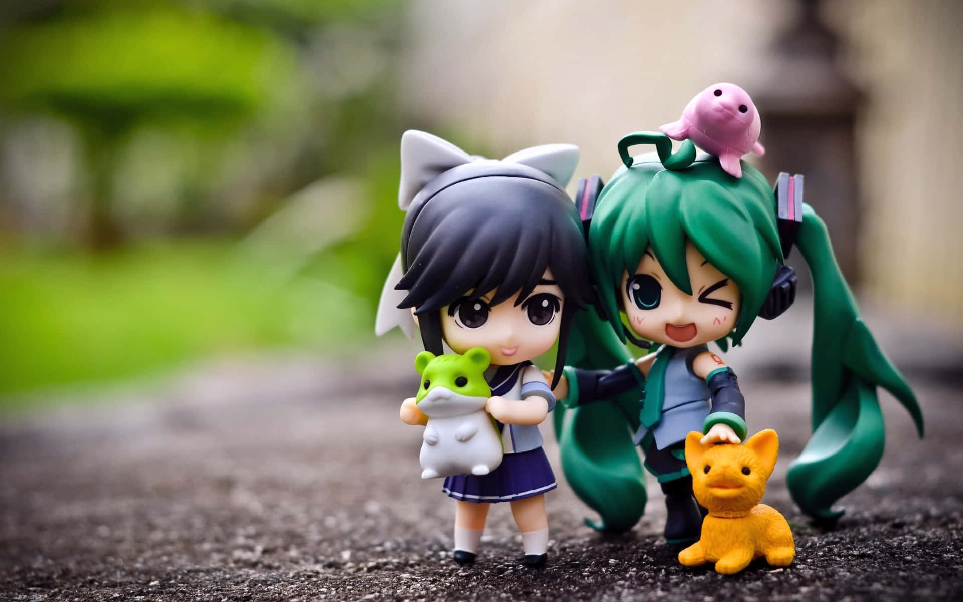 Adorable Anime Figurines Outdoors Wallpaper