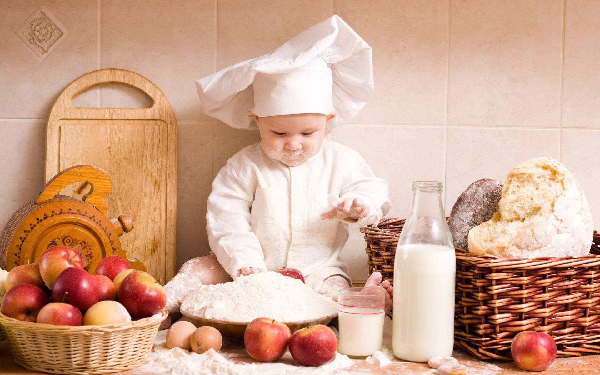 Adorable cooking baby wallpaper.