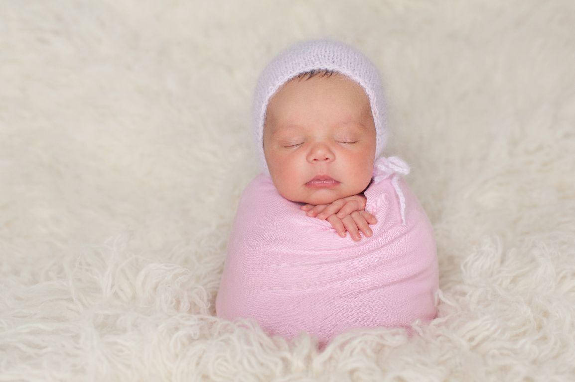 Adorable Newborn Baby Sleeping Peacefully Wallpaper