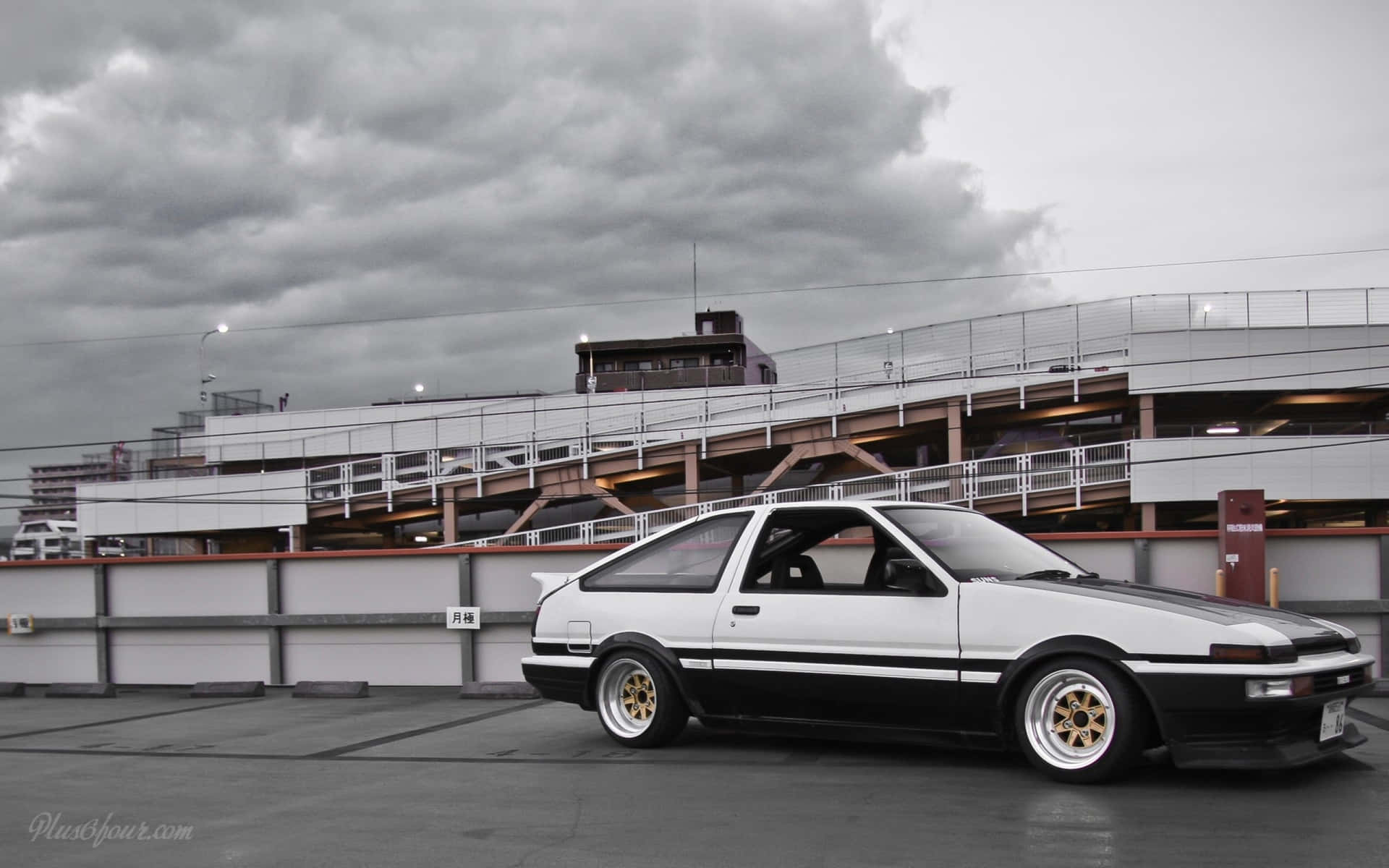 An iconic Toyota AE86 framed against a beautiful skyline Wallpaper