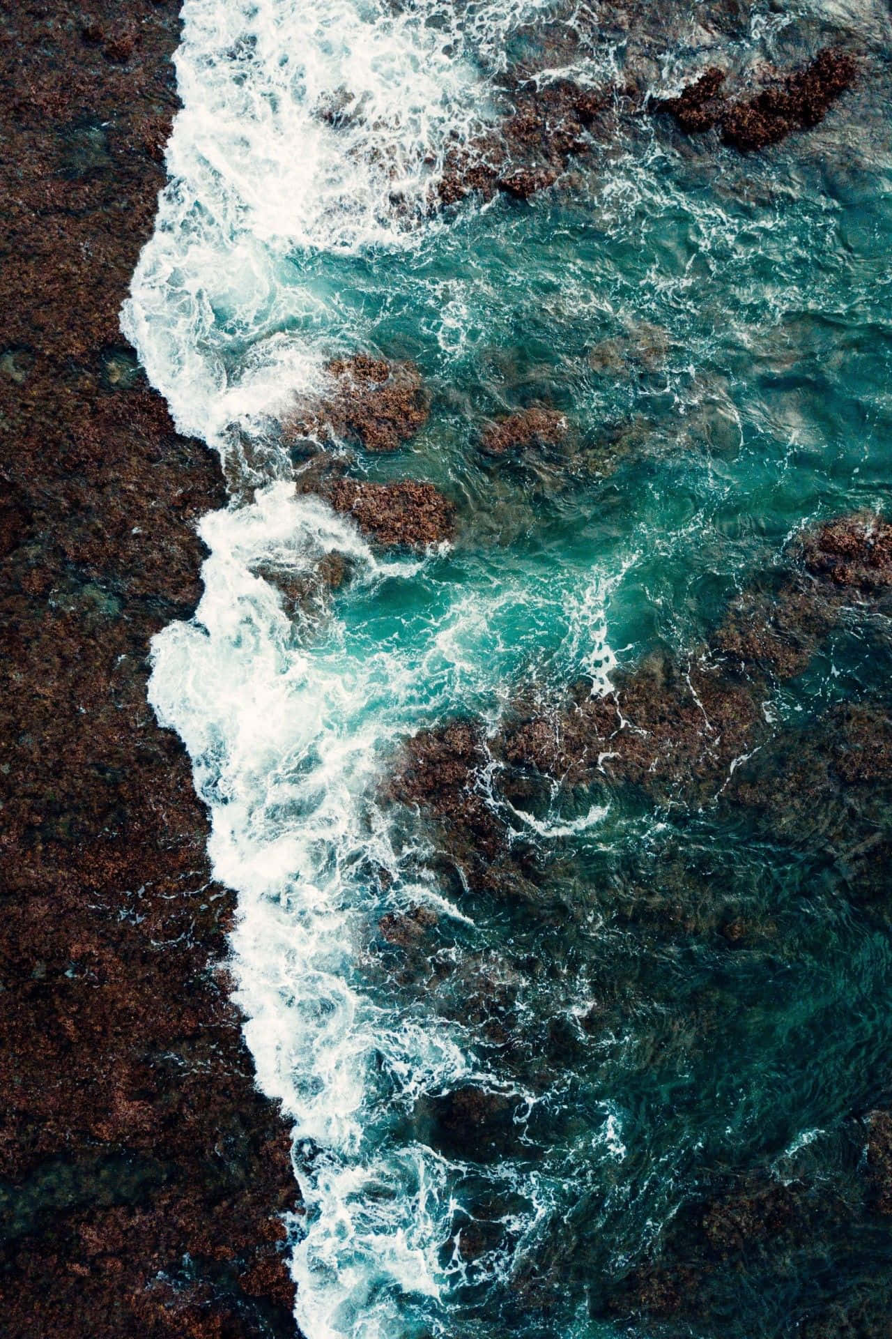 Aerial_ Ocean_ Foam_on_ Rocks_4 K_ U H D Wallpaper