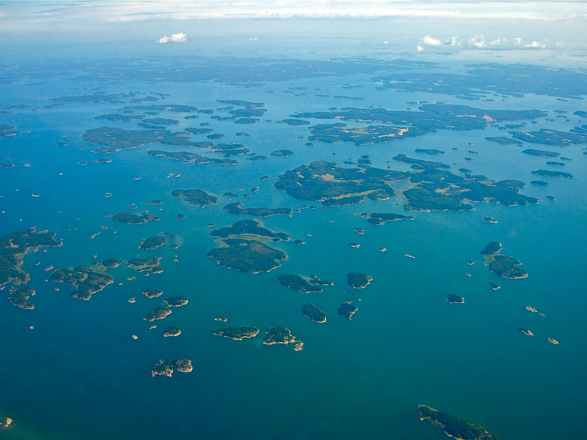 Aerial_ View_of_ Coastal_ Archipelago.jpg Wallpaper