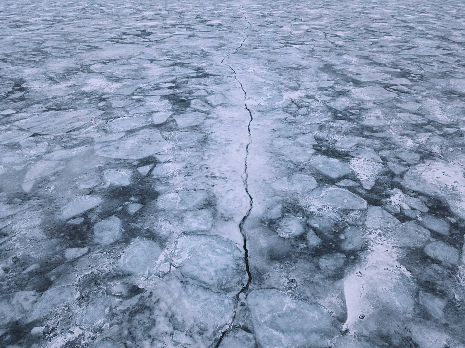 Aerial View Of Cracked Ice Lake
