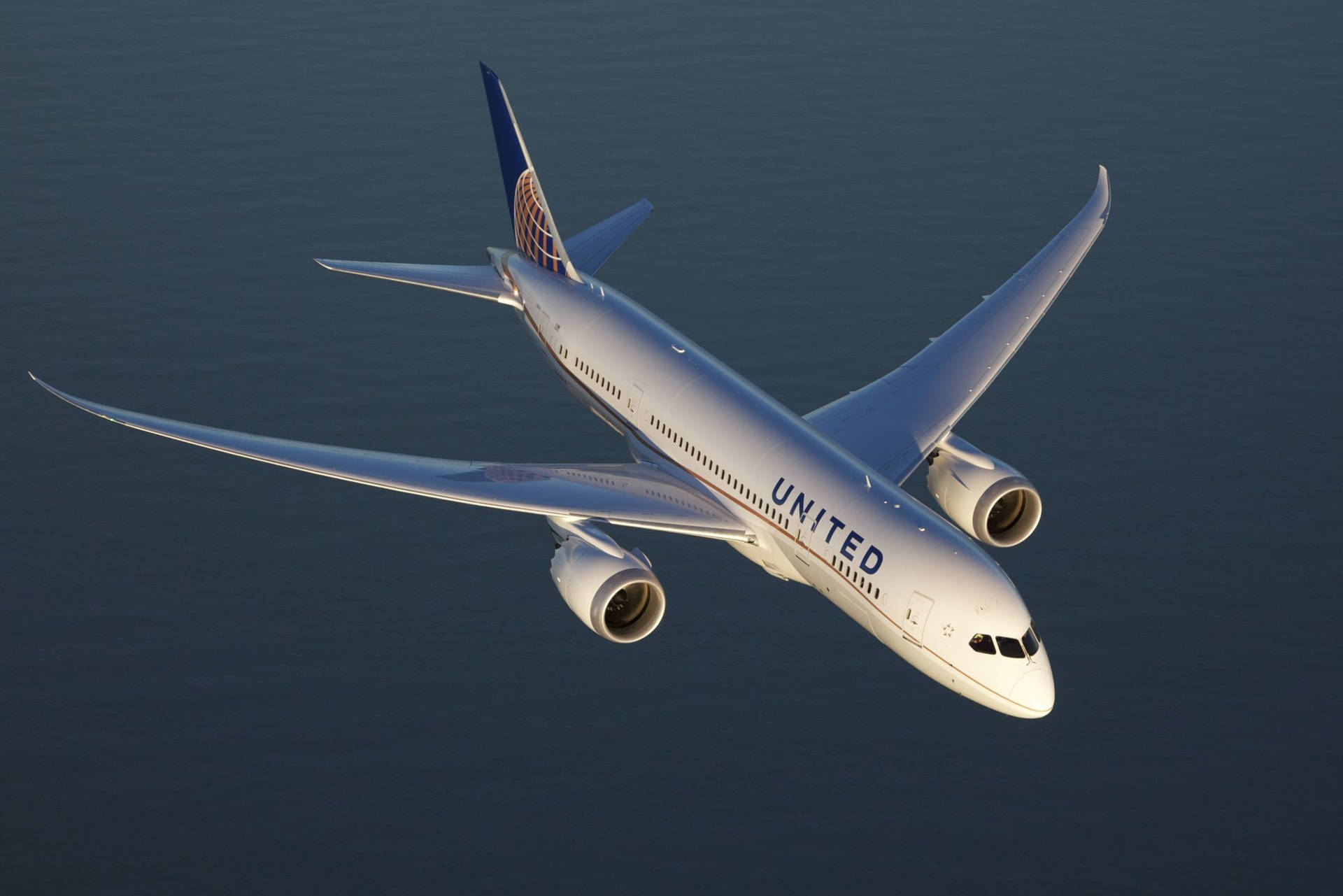 Aerial View Of Flying United Airplane Wallpaper