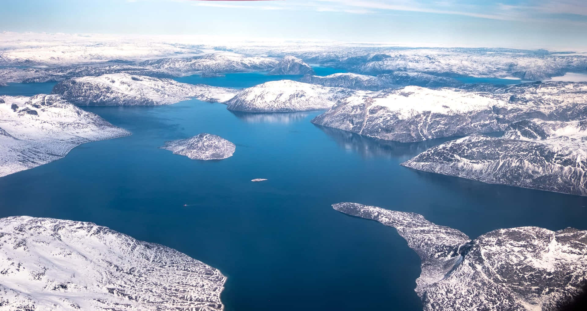 Aerial_ View_of_ Snowy_ Fjord_ Landscape Wallpaper