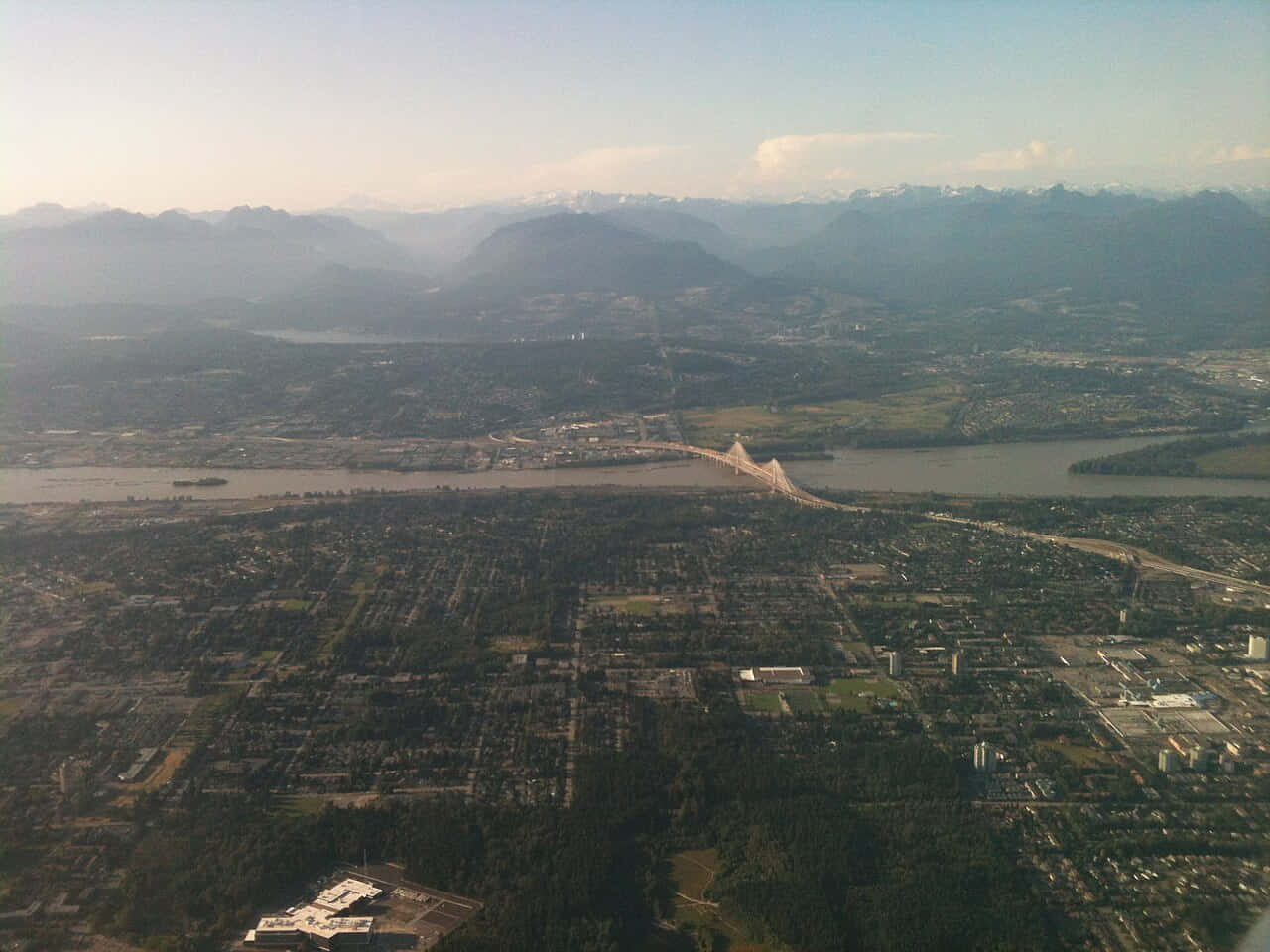 Download Aerial_ View_of_ Surrey_ Canada_with_ Mountains Wallpaper ...