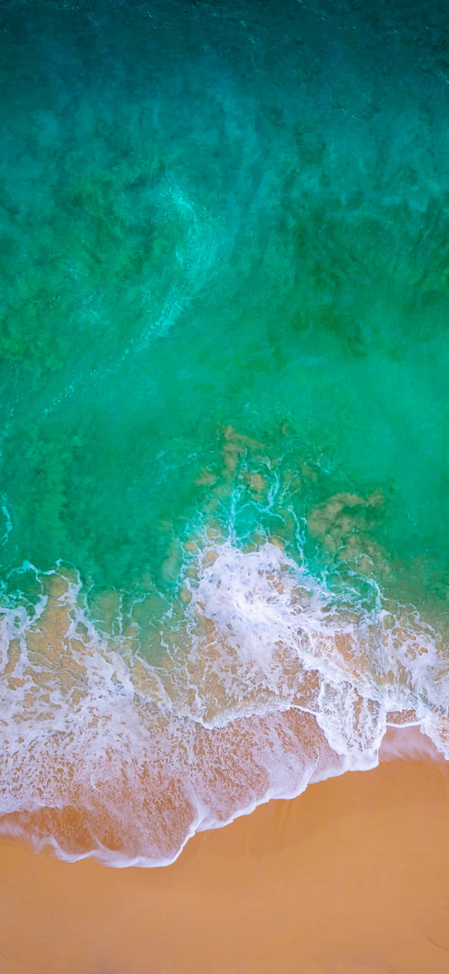 Aerial View Turquoise Seaand Sandy Beach Wallpaper