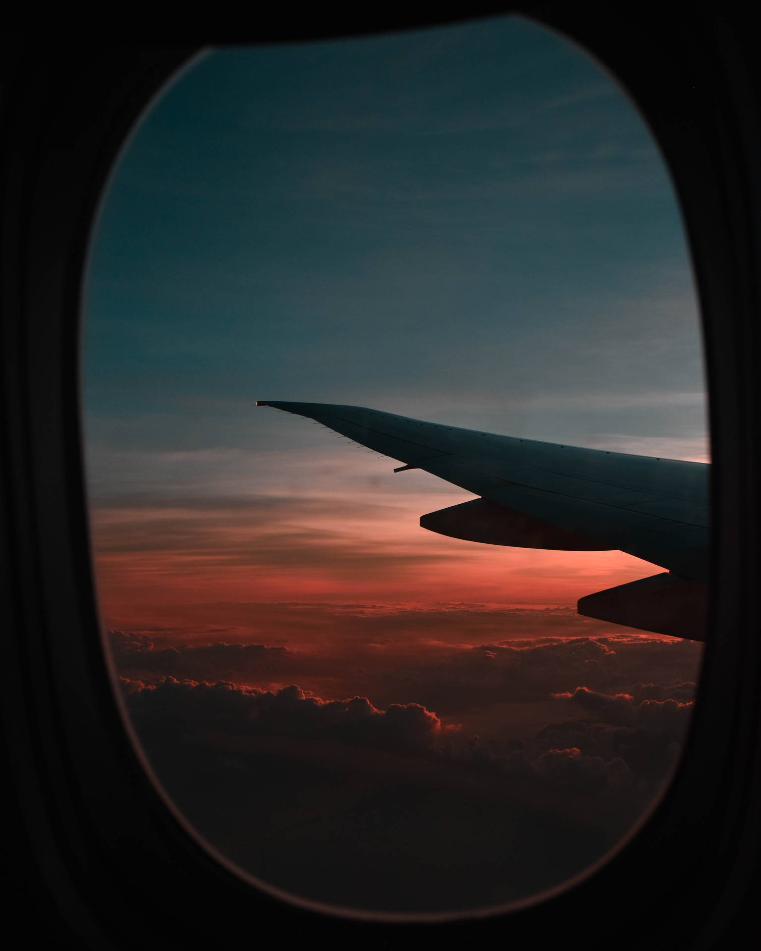 Flugzeugfenstersonnenuntergang Aussicht Wallpaper