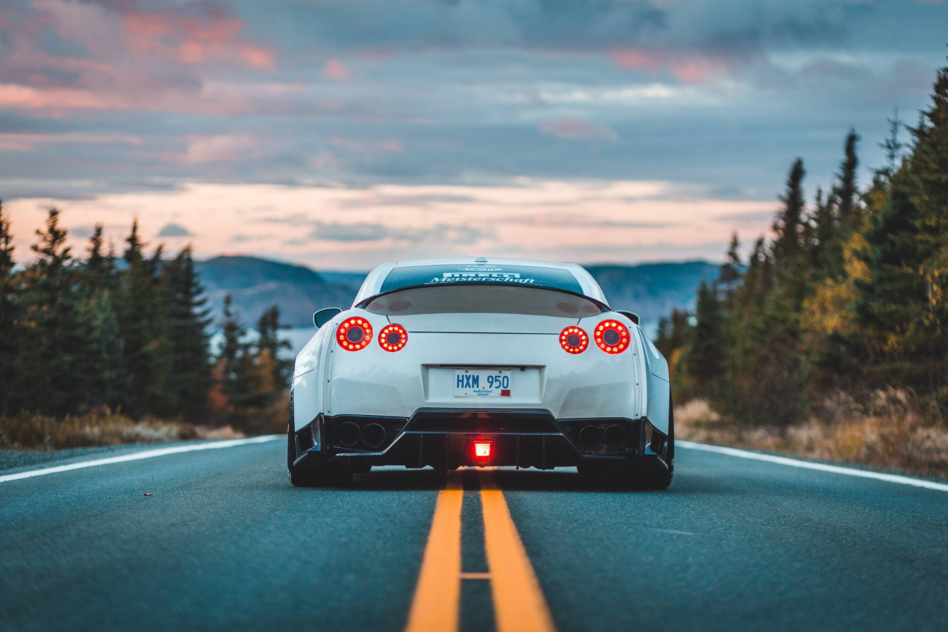 "Aesthetic Nissan GT-R Gliding Through The Night" Wallpaper