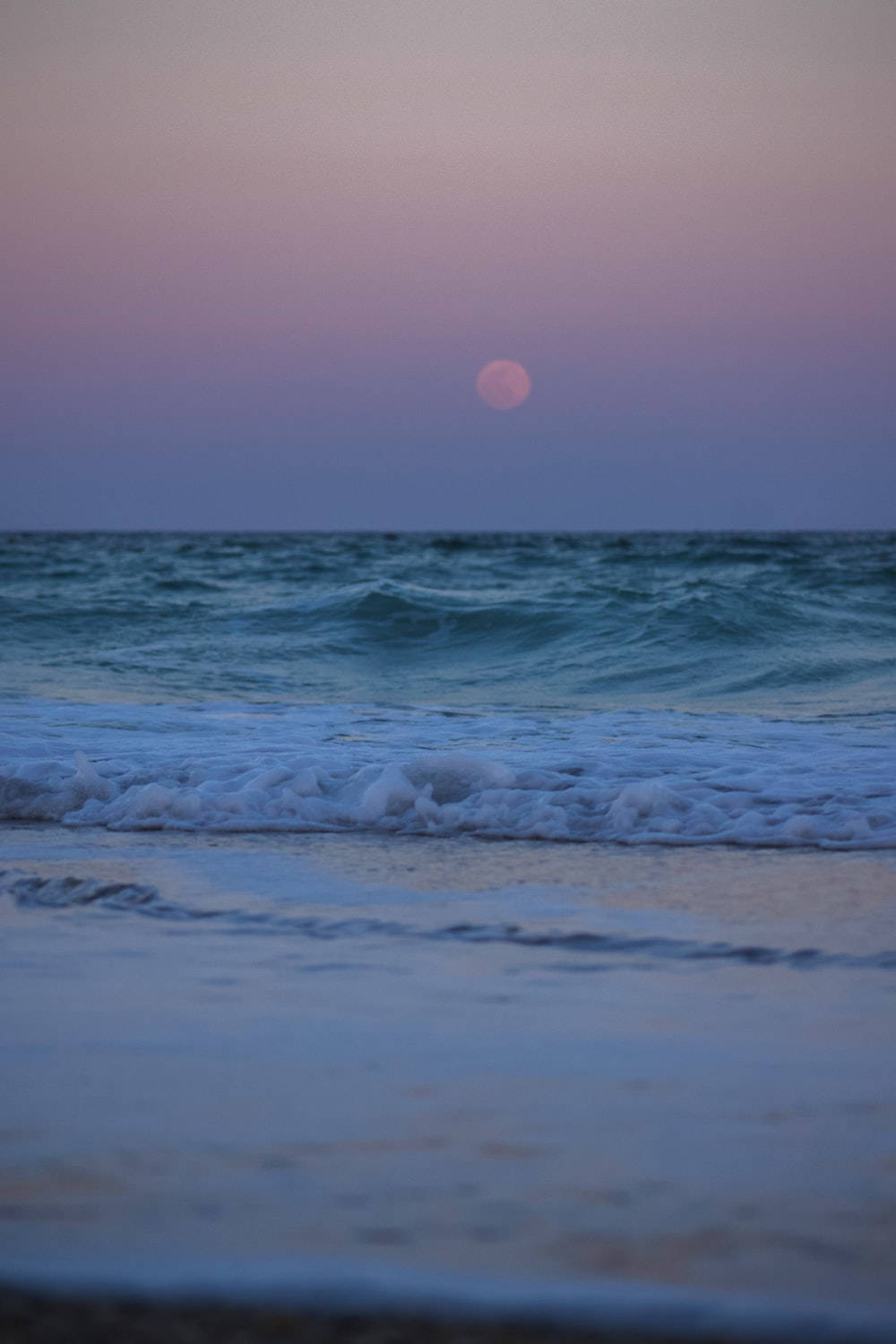Caption: Enchanting Serenity - A Calm Aesthetic Beach at Night. Wallpaper