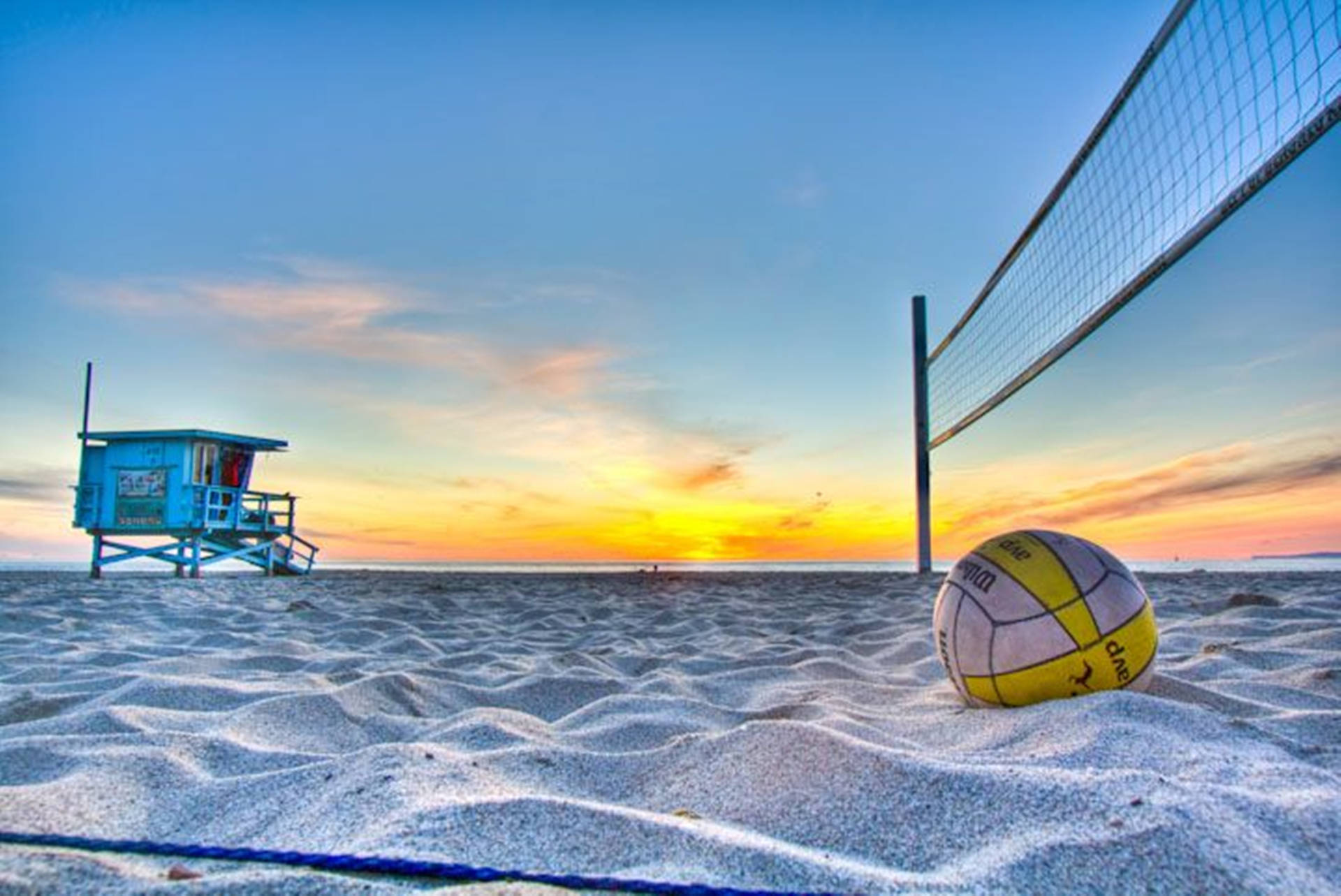 Aesthetic Beach Volleyball And Lifeguard Post Wallpaper