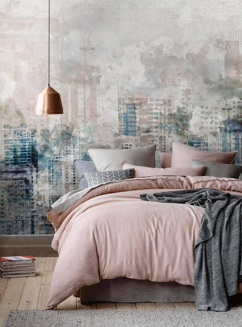 A Bedroom With A Pink Bed And A City Mural Wallpaper