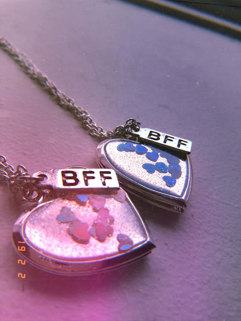 Two Necklaces With The Words Bff And Bff Wallpaper