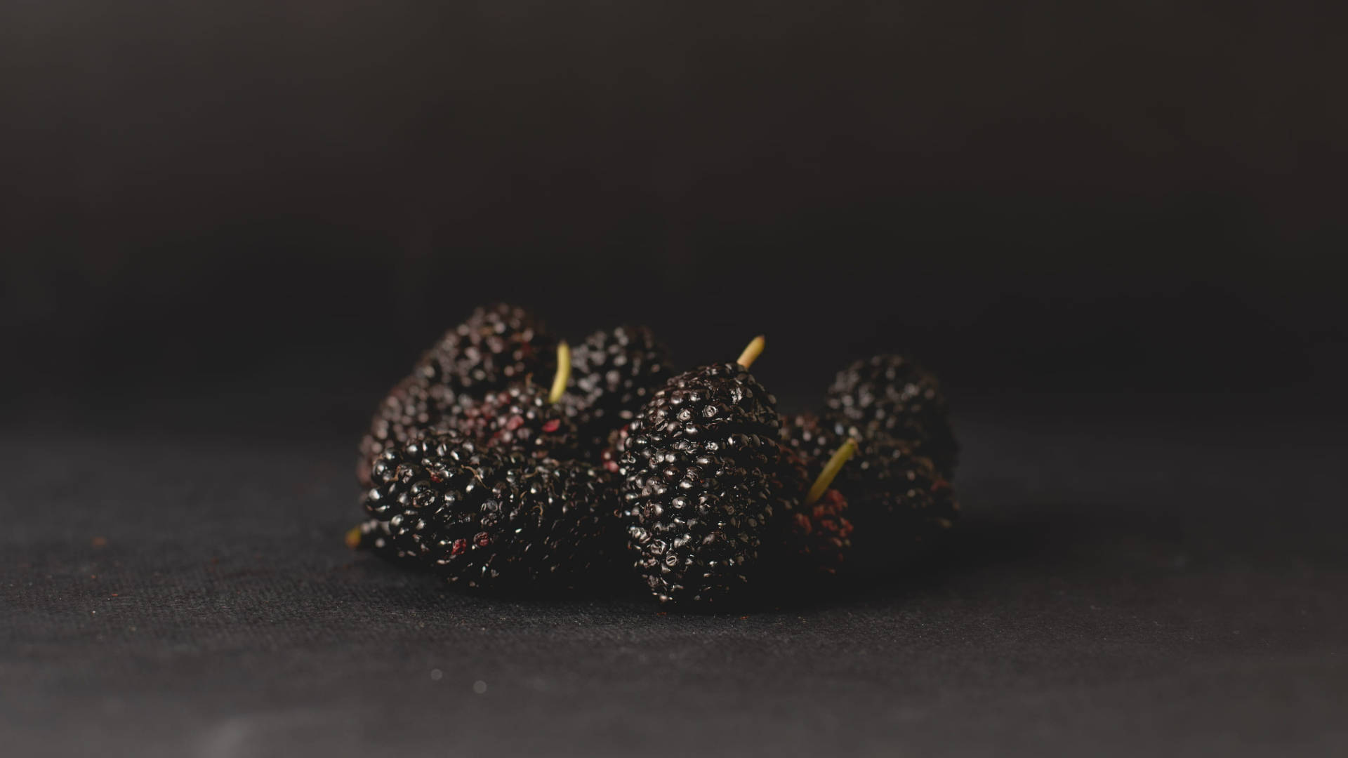 Aesthetic Black Mulberry Fruits On Black Wallpaper