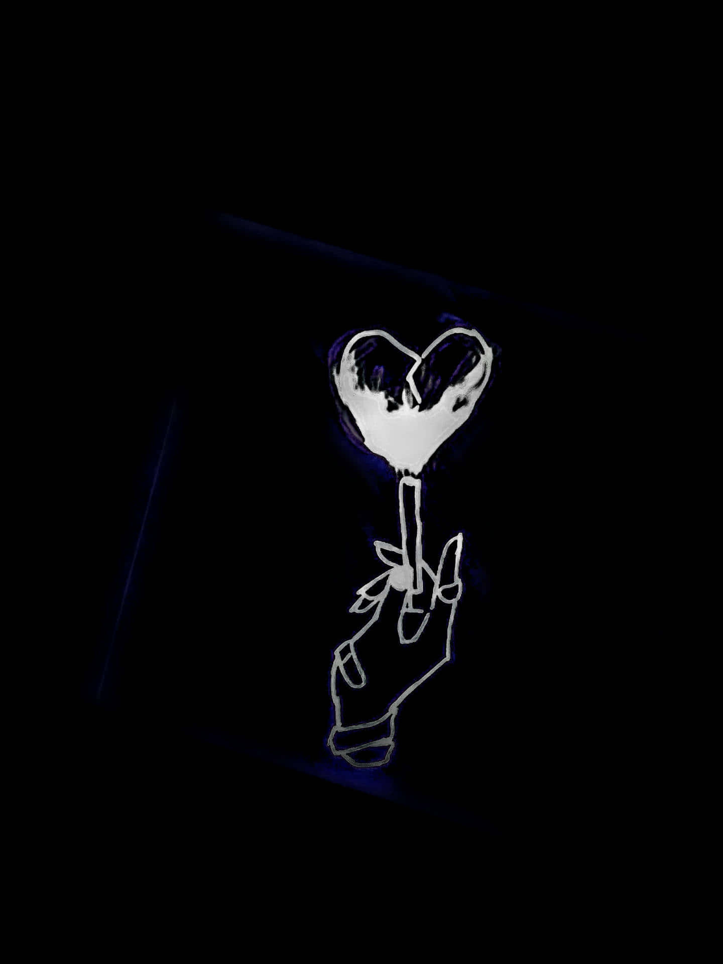 A Hand Holding A Heart In The Dark