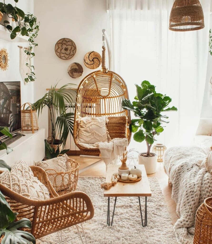 A Living Room With A Lot Of Plants And Wicker Furniture