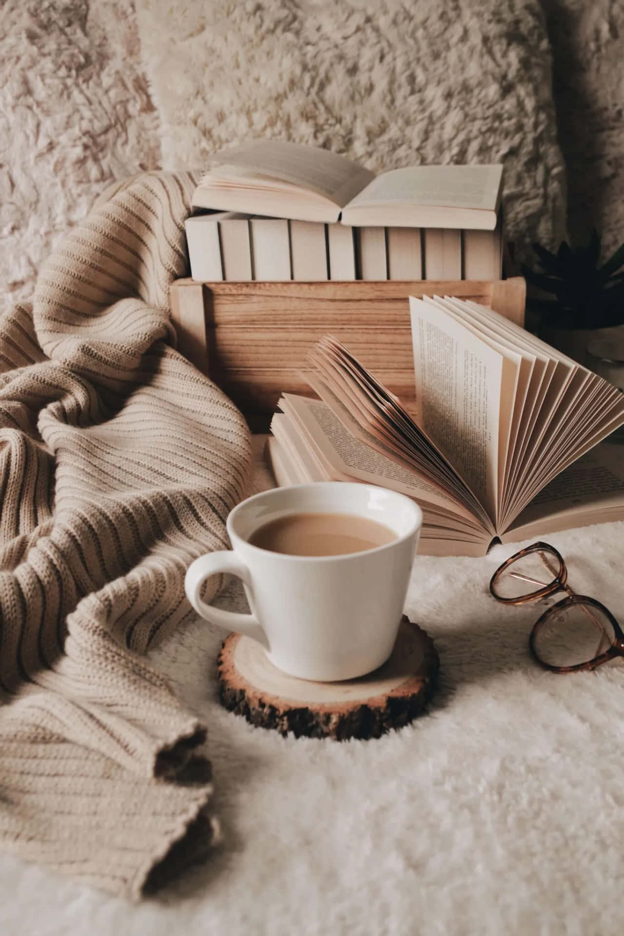 A Cup Of Coffee, Books, Glasses And A Blanket