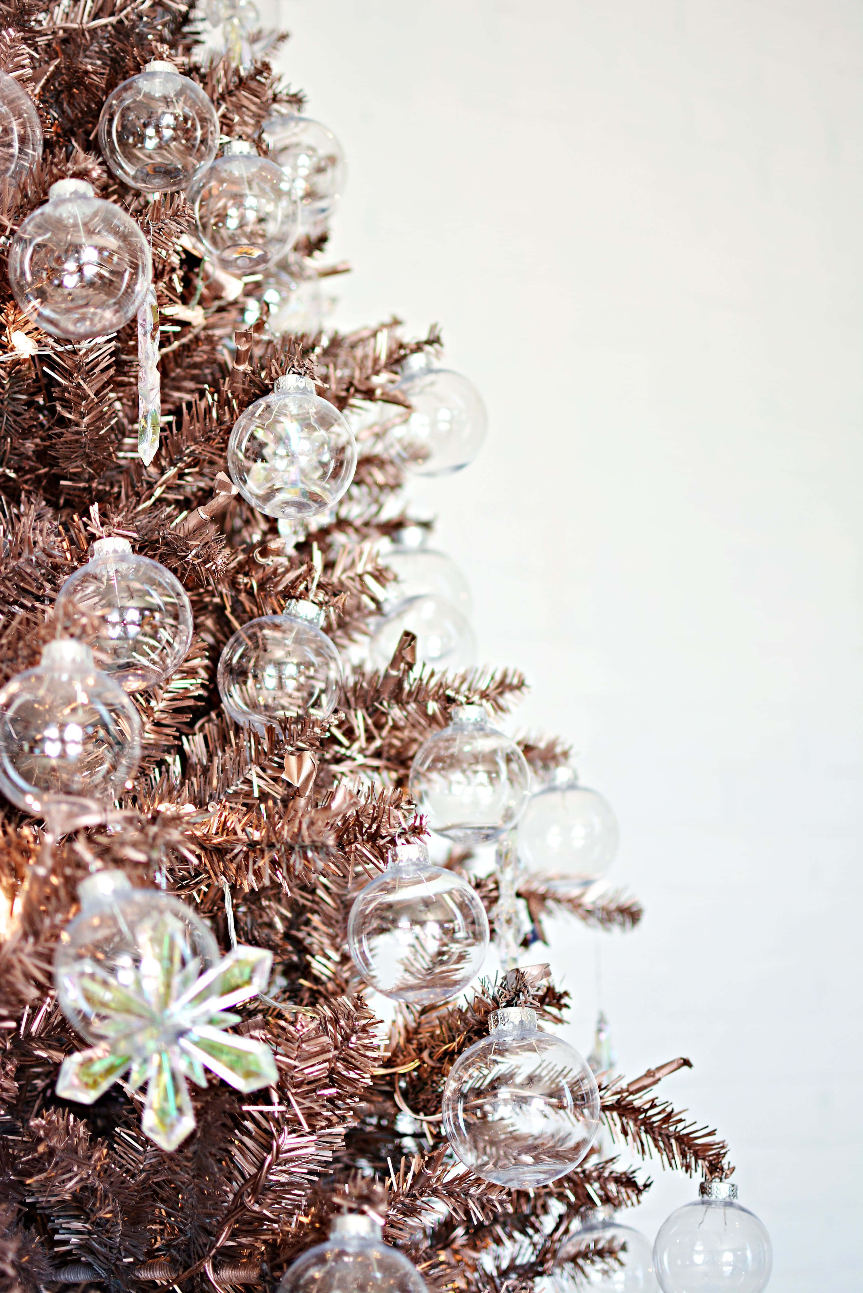 A Christmas Tree With Glass Ornaments Wallpaper