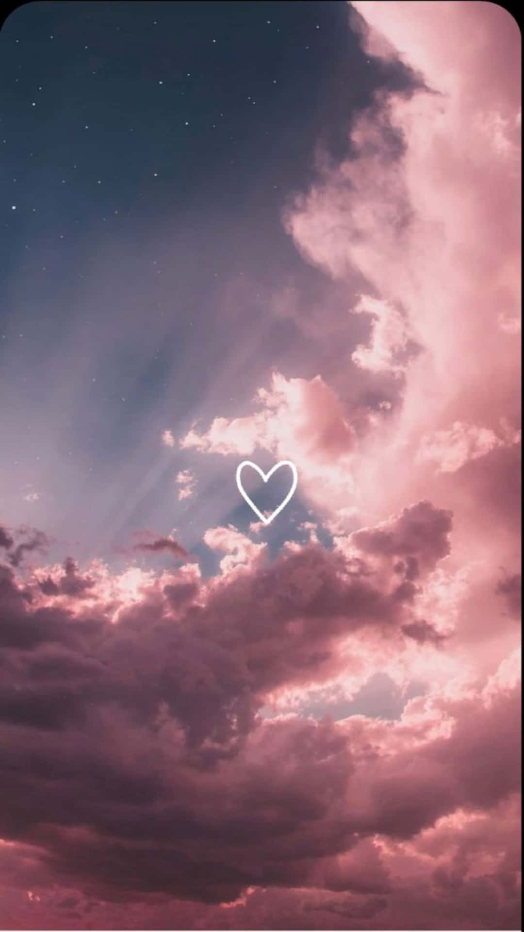 a pink sky with clouds and a heart