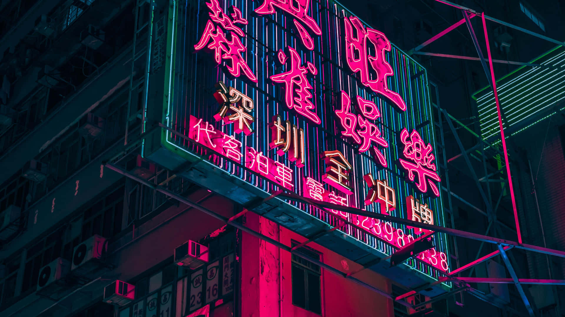Et neon skilt på en bygning væg Wallpaper