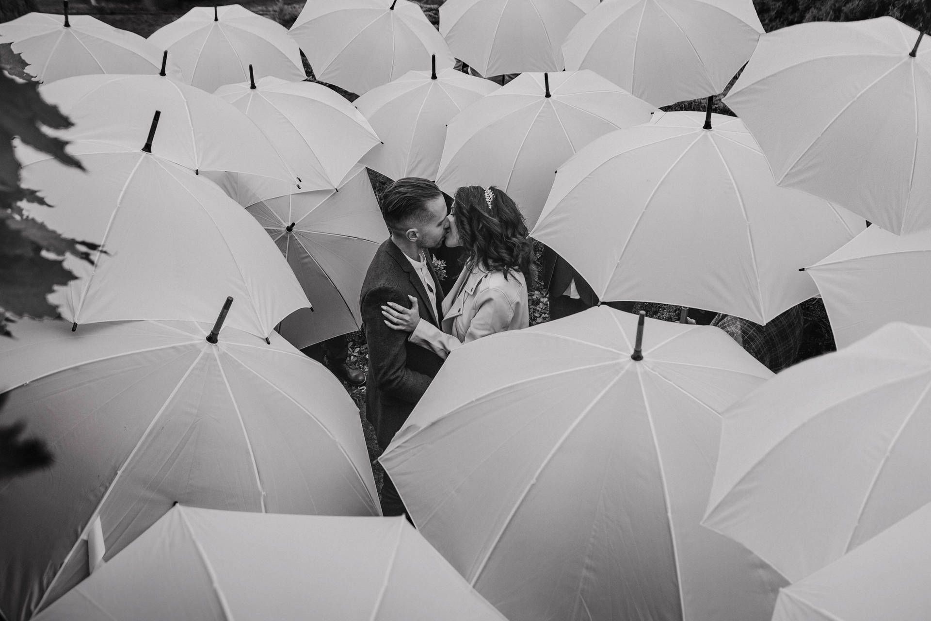 Aesthetic Couple Surrounded With Umbrellas Wallpaper